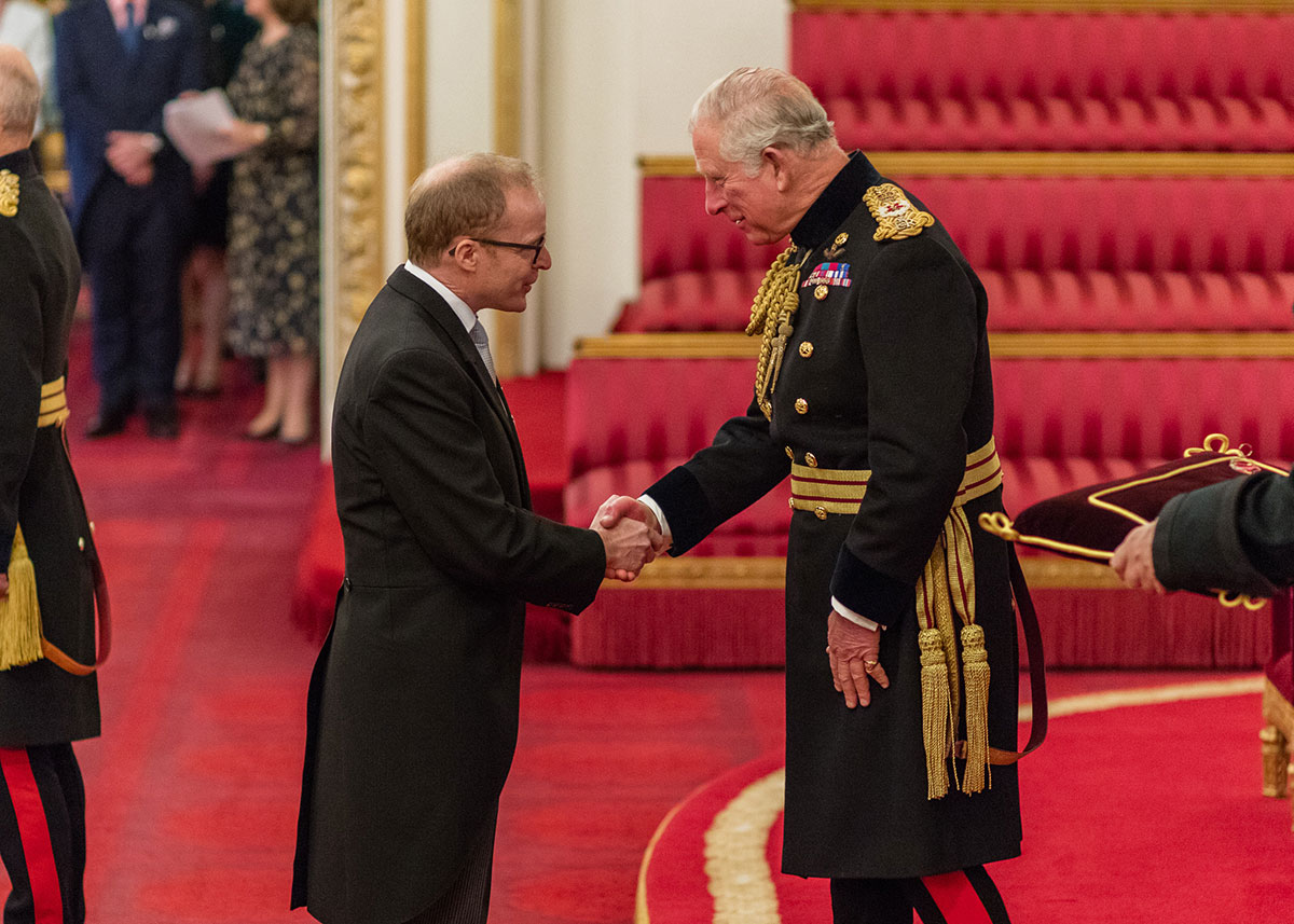 Roger Smith receives his OBE from Charles, Prince of Wales